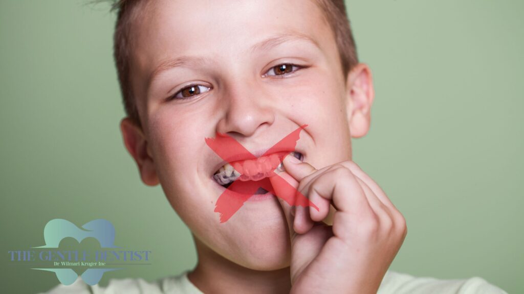 Why Is My Child Grinding Their Teeth at Night? Causes, Myths, and What to Do 3 Older child with clear night guard showing that they can't be used in children | Night guards for kids at The Gentle Dentist Centurion.