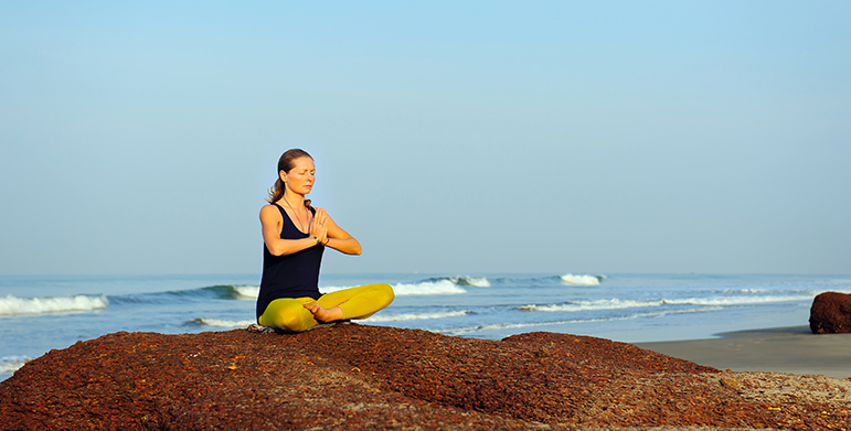 Calm Goa beach landscape with gentle waves and open sky symbolizing inner stillness and relaxation