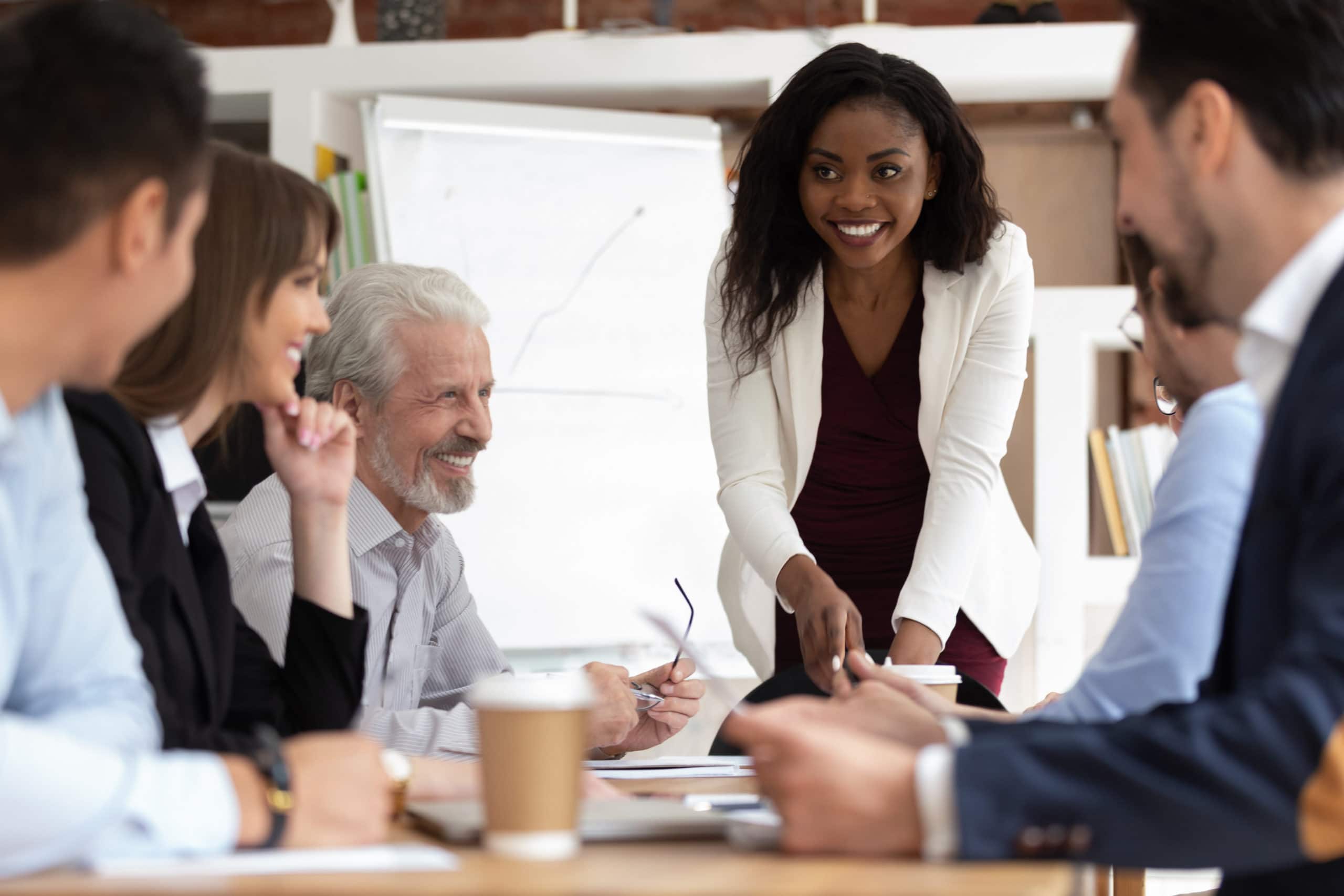 Build Trust with an Authentic Company Story Team meeting showcasing company transparency and teamwork.