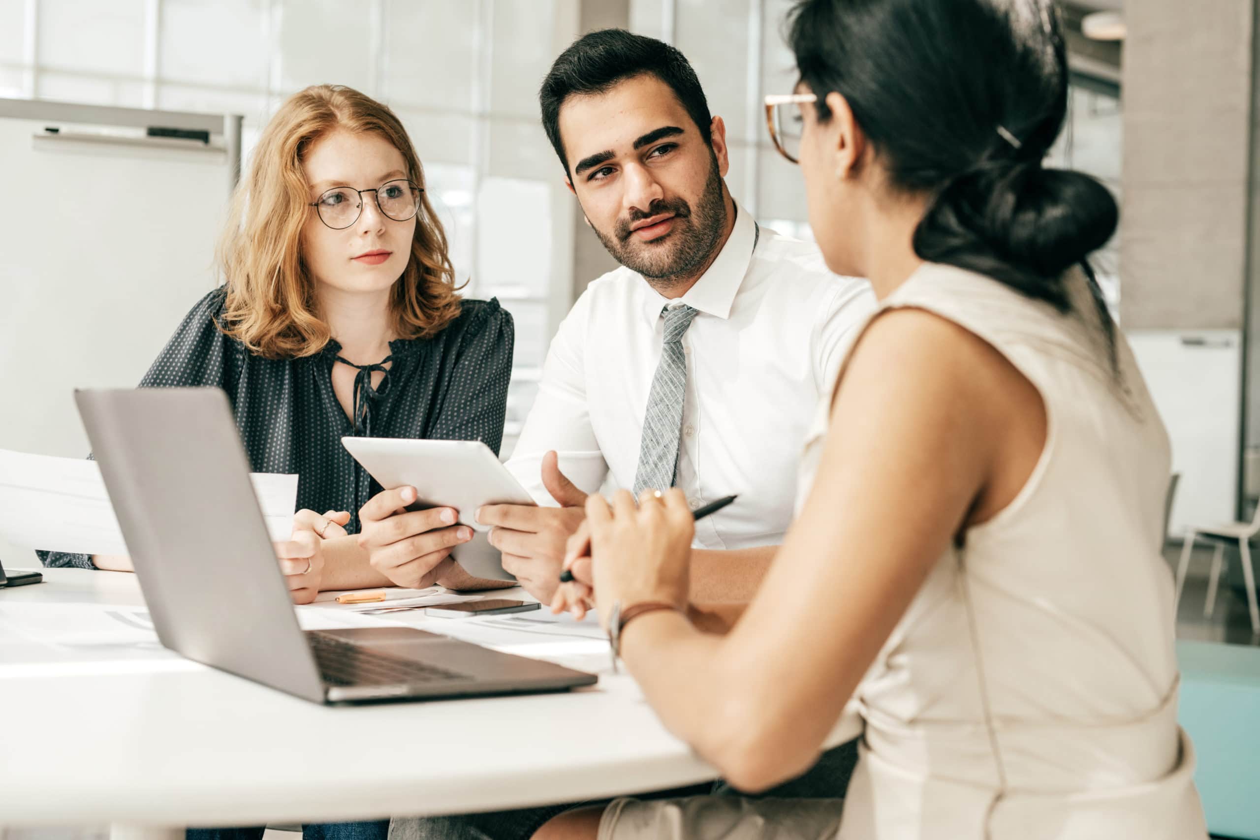 Effective outbound calling team discussing sales strategies Business team engaged in outbound calling strategy discussion in office.