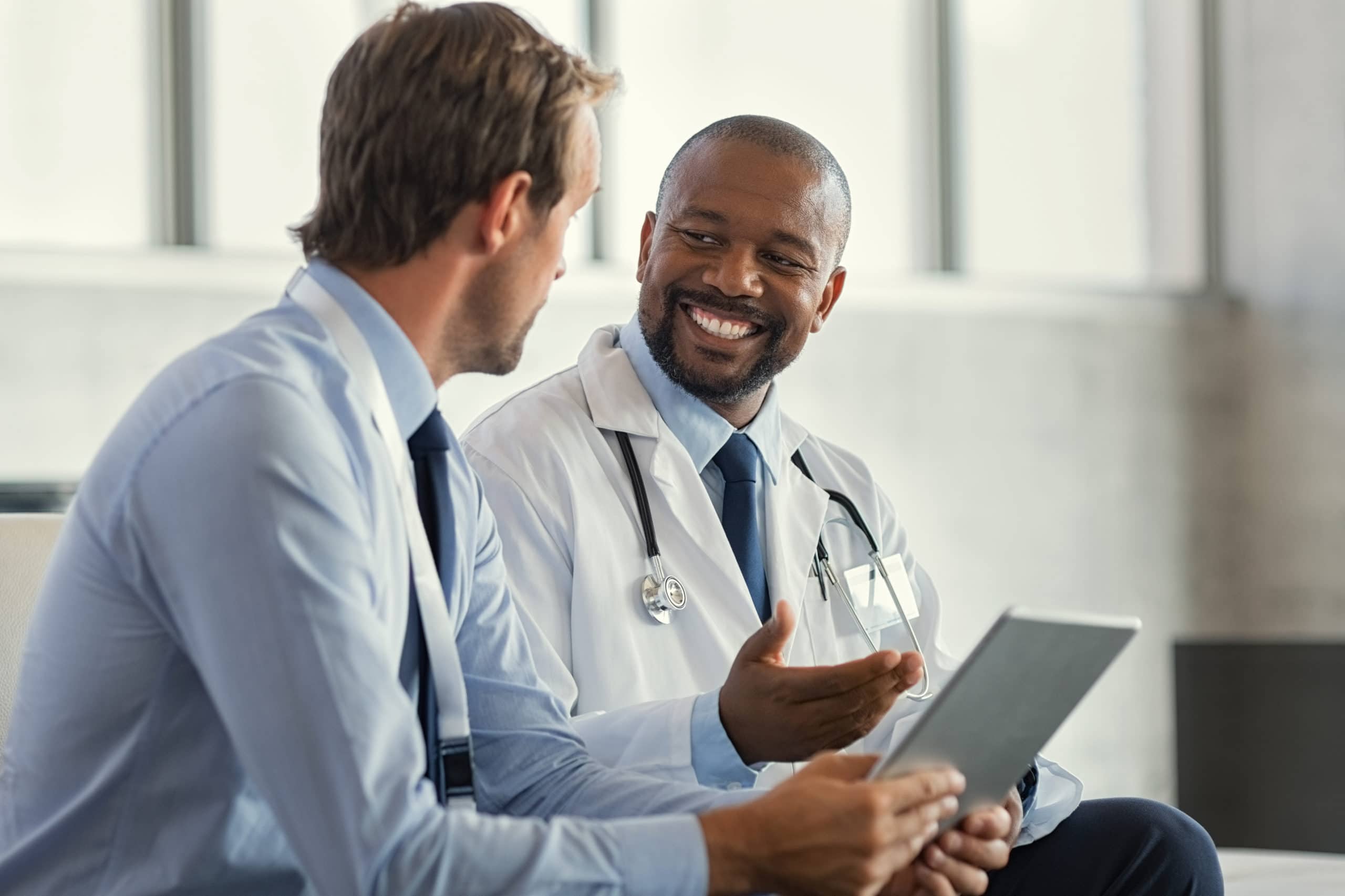 Medical professionals discussing healthcare strategies during COVID-19. Healthcare lead generation in medtech during COVID-19.