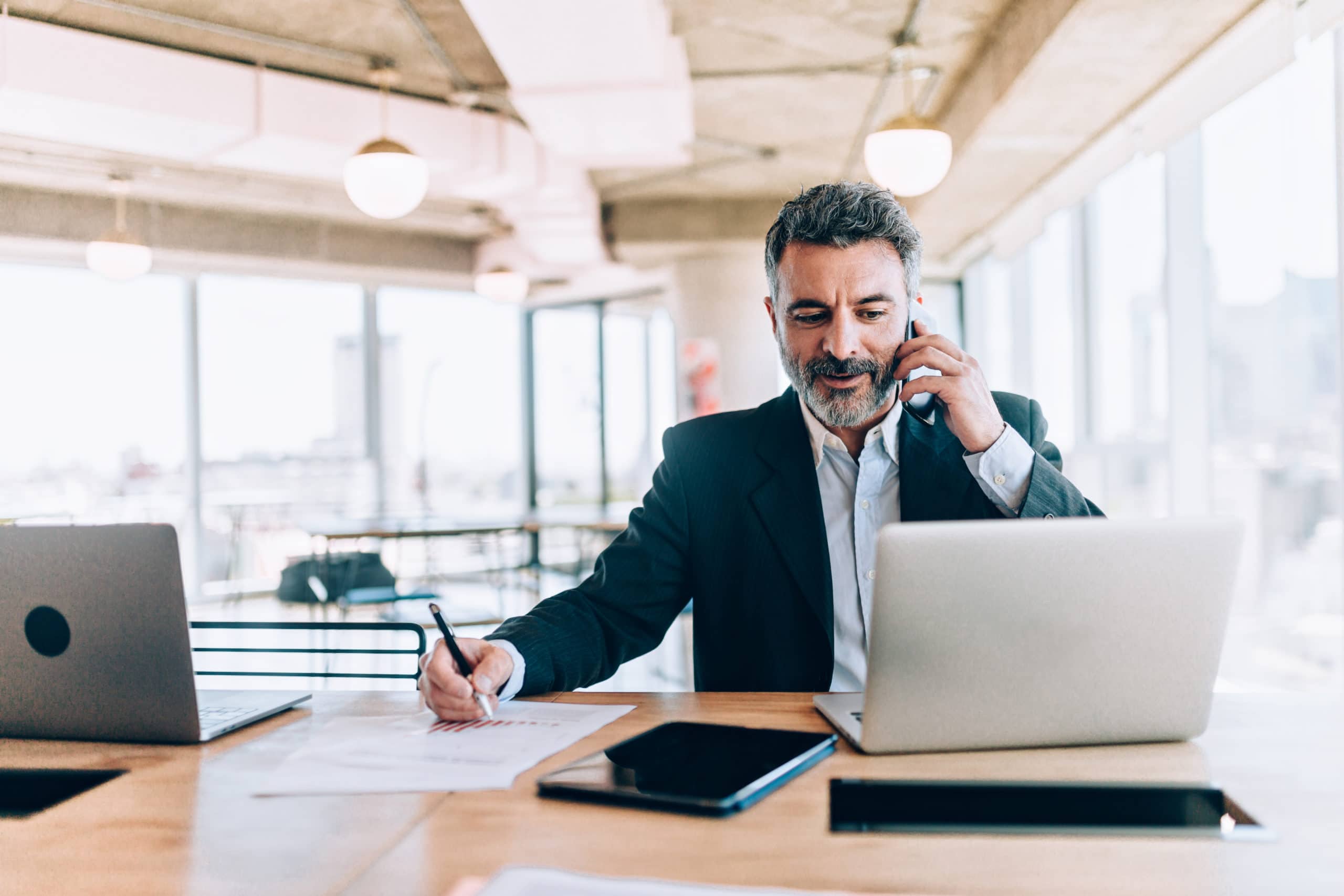 Effective Lead Generation Calling for Business Growth Business professional making a lead generation call in modern office setting.