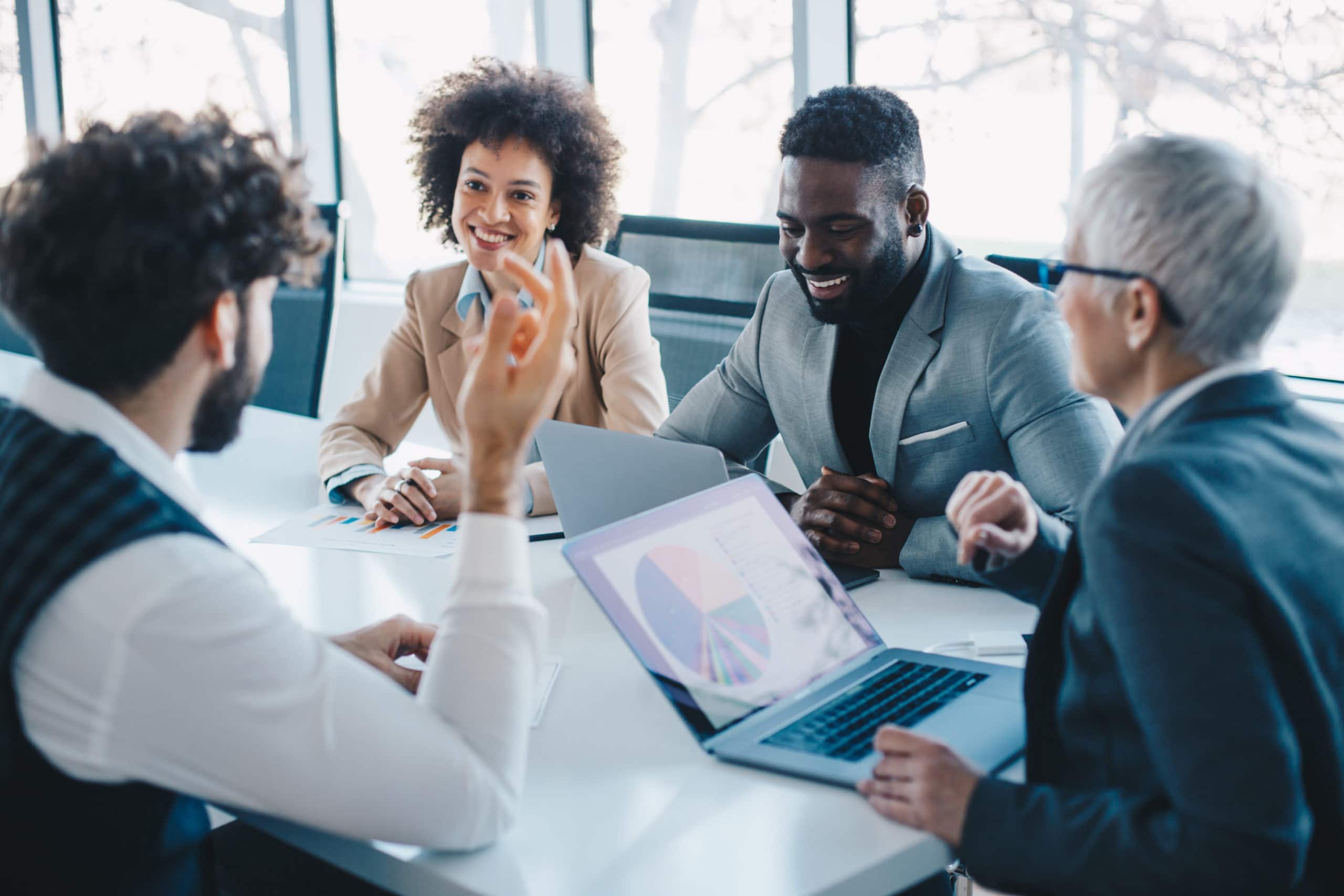 Building sales buy-in for outsourced lead generation Business team discussing lead generation strategies in a modern office.