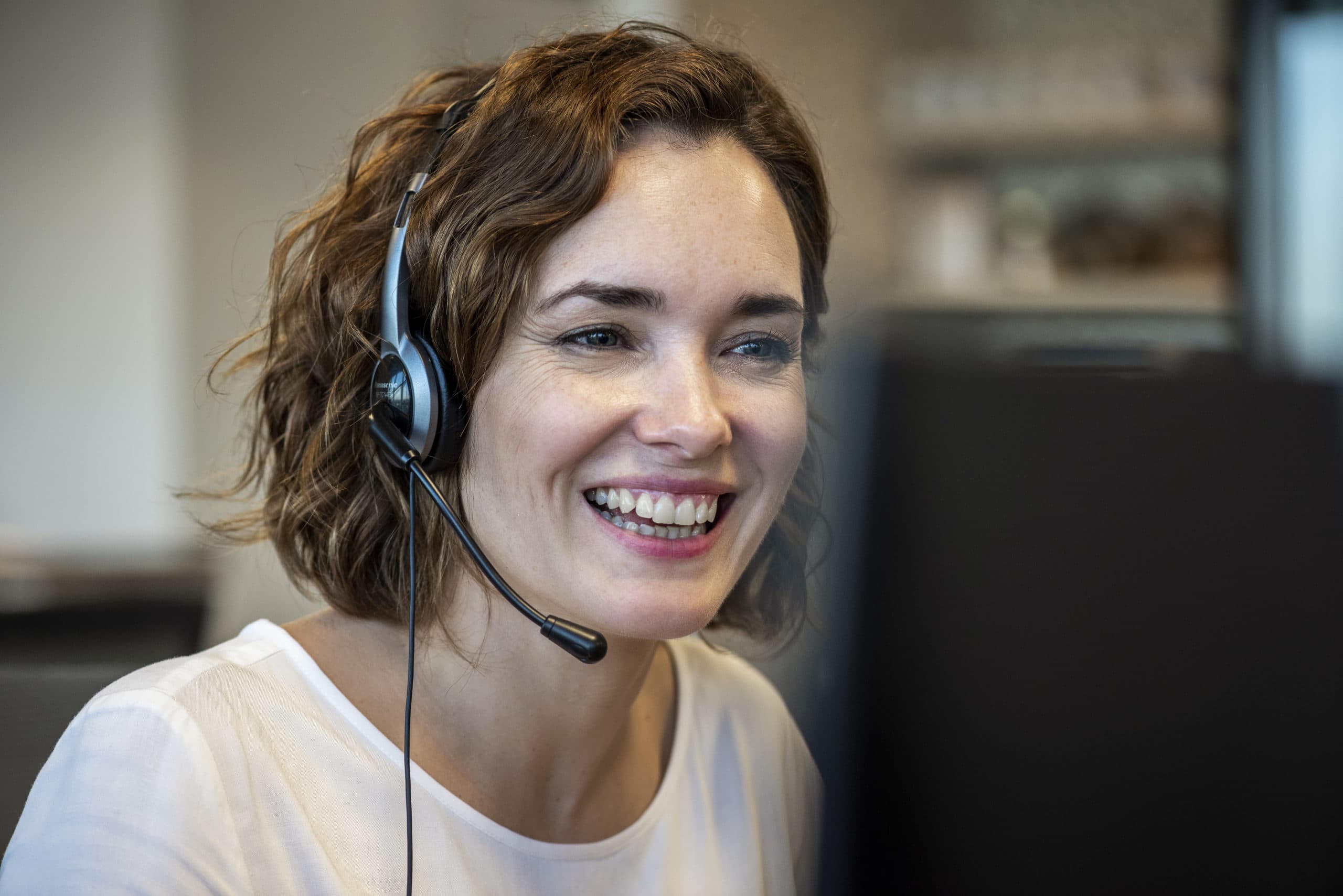 Customer Service Representative with Headset Customer service agent wearing a headset for inside sales support.