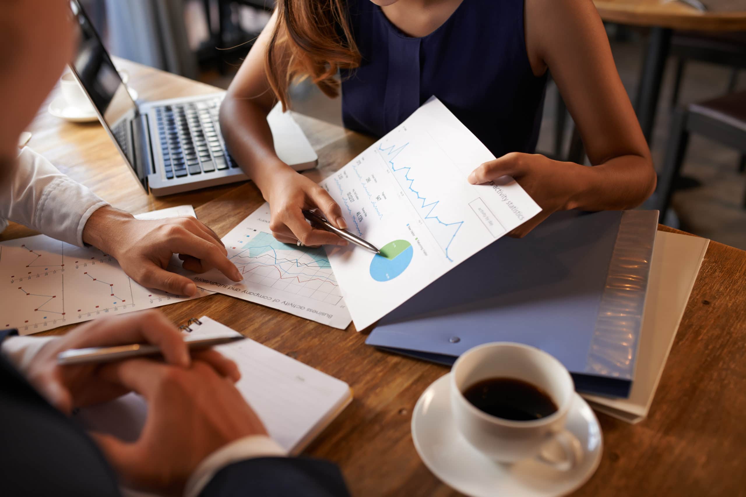 Effective sales team collaboration for call center success. Call center team analyzing sales data and strategies for improved performance.
