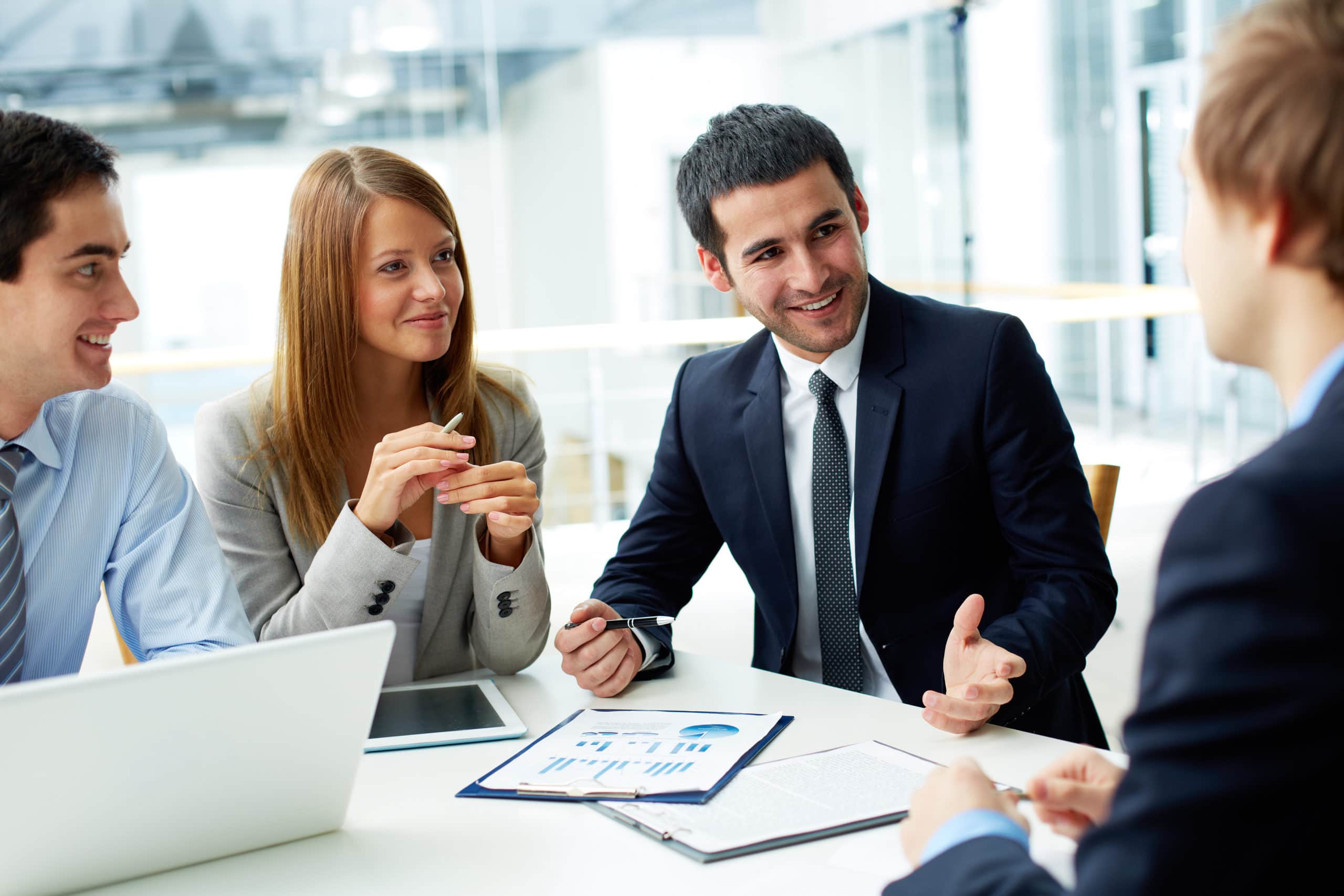 Boosting Sales Prospecting Strategies Business team discussing sales prospecting techniques in a modern office.