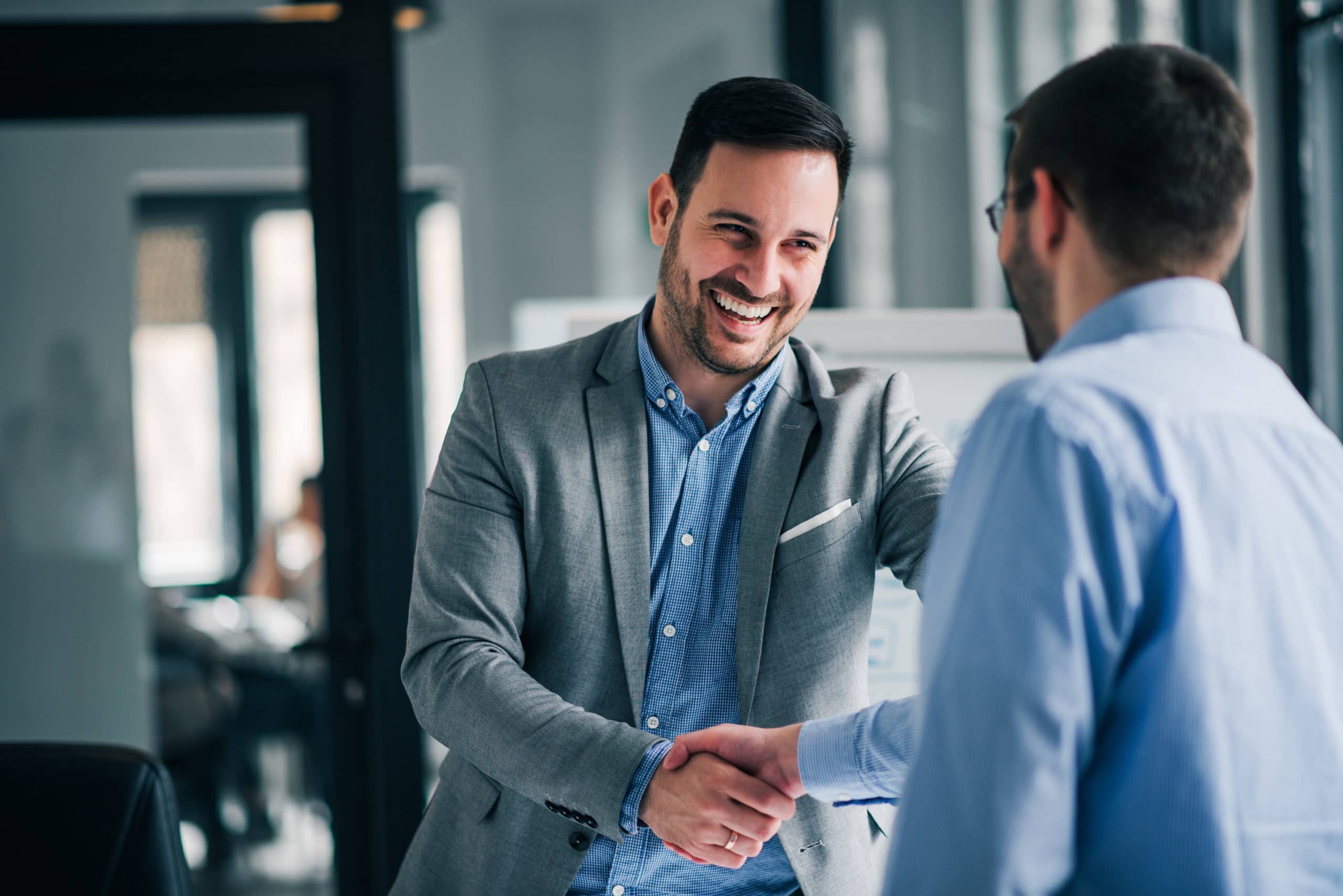 Sales team handshake for business success Inside and outside sales teams collaborating effectively.