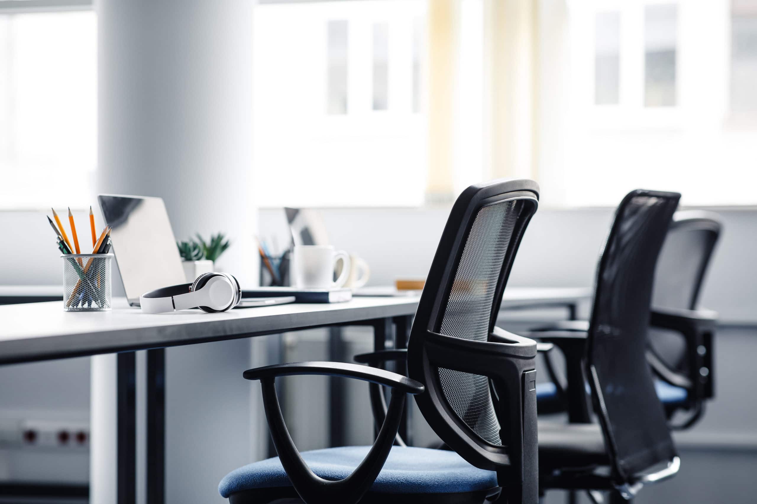 Flexible Inside Sales Office Setup for Outsourcing Success Inside sales outsourcing office with ergonomic chairs and modern workspace for efficient remote sale.