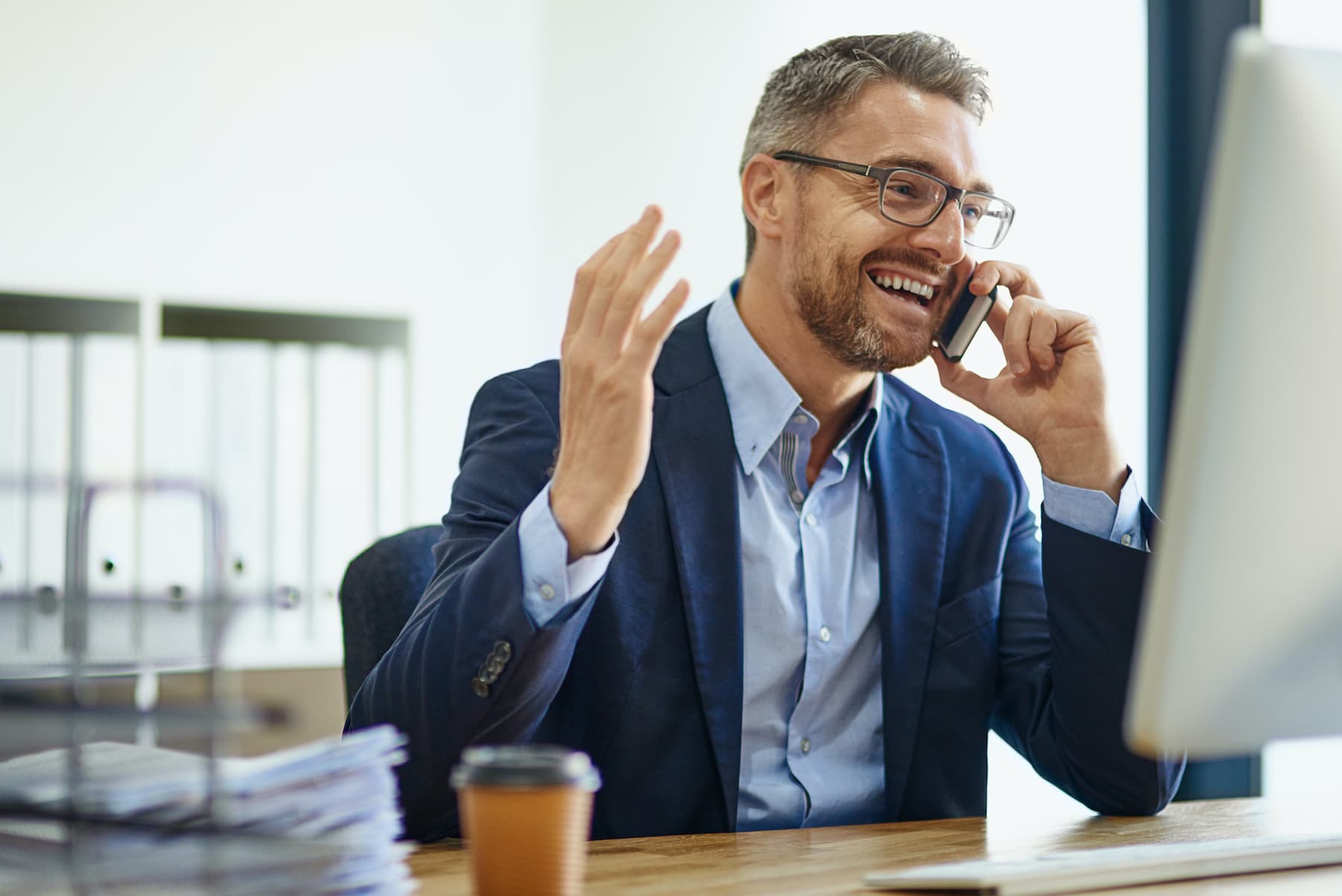 Effective Sales Call Engagement Strategies Businessman engaging prospects during a sales call on his phone.