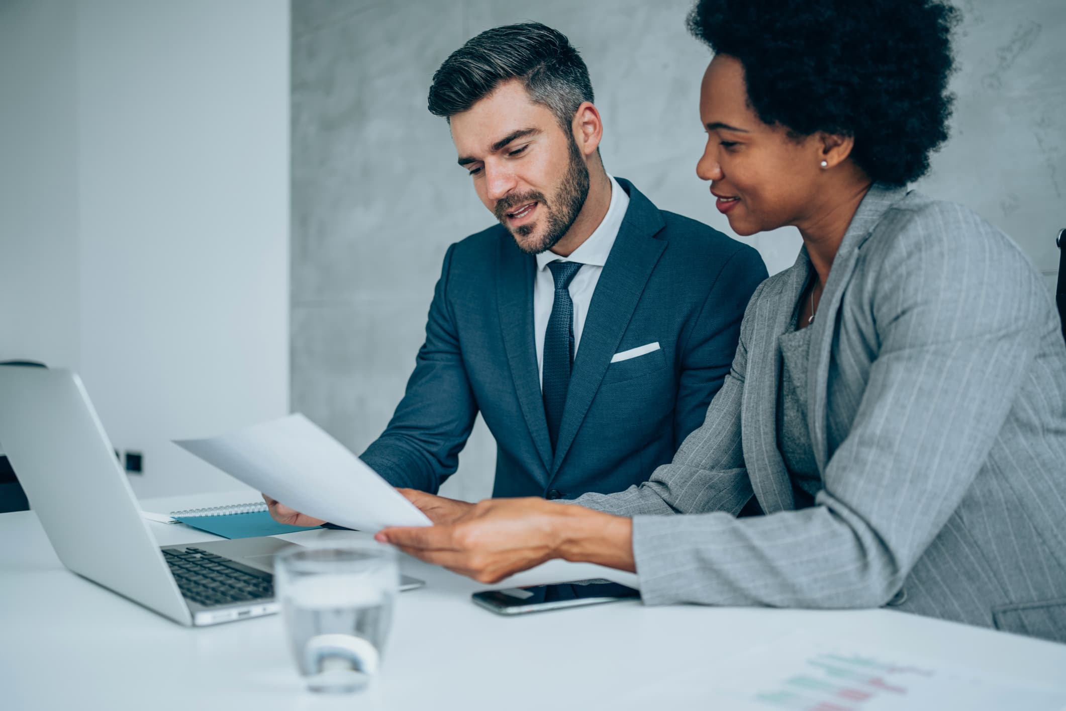 Effective Sales Call Strategies for Decision-Makers Business professionals discussing sales strategies with decision-makers in a meeting.