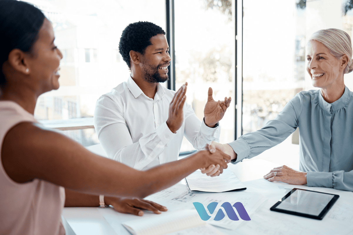 Boost Your B2B Outreach with Cold Calling Strategies Business professionals shaking hands during a successful B2B cold call meeting.