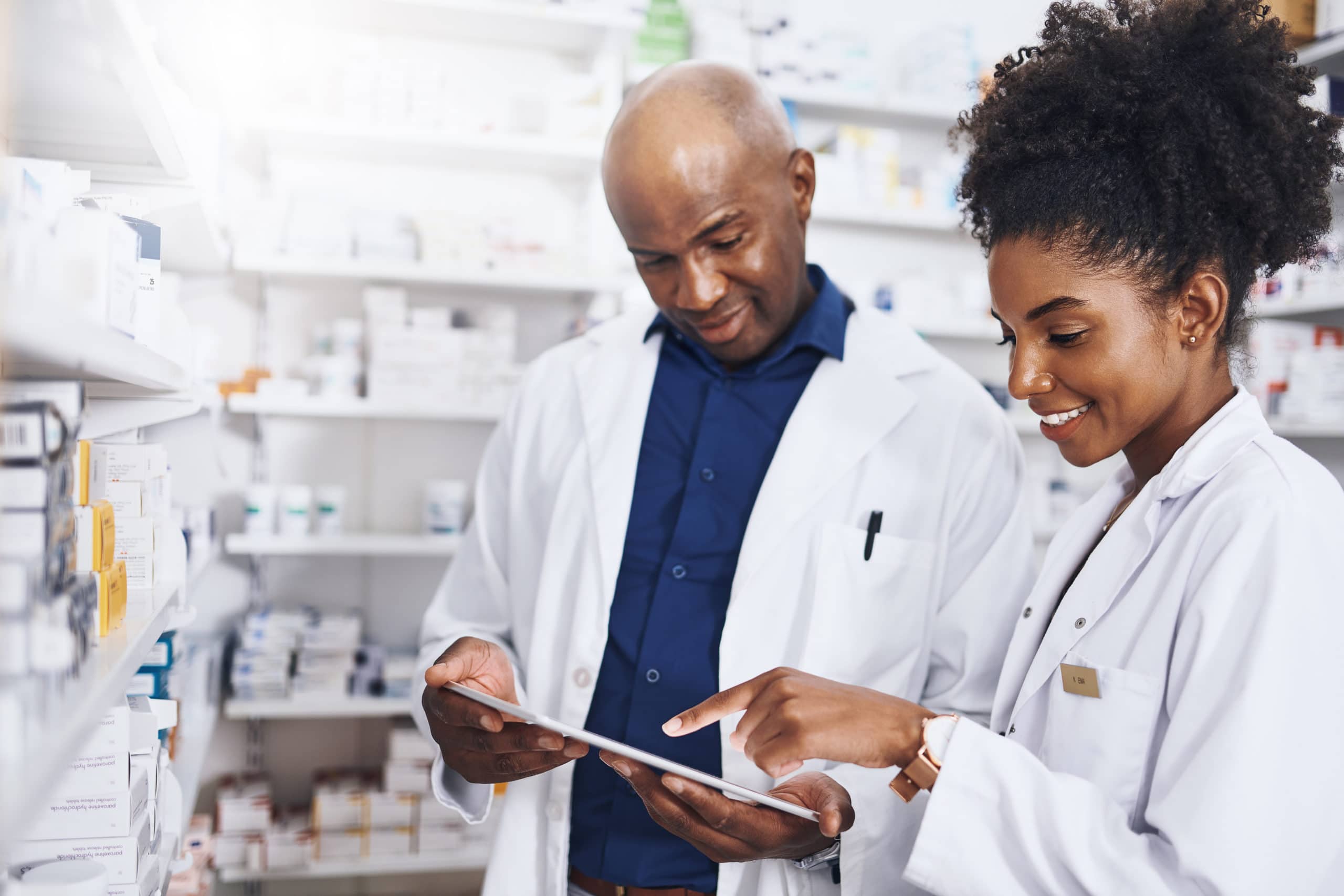 Pharmaceutical Sales Team Collaboration Healthcare professionals discussing sales strategies in pharmacy setting.