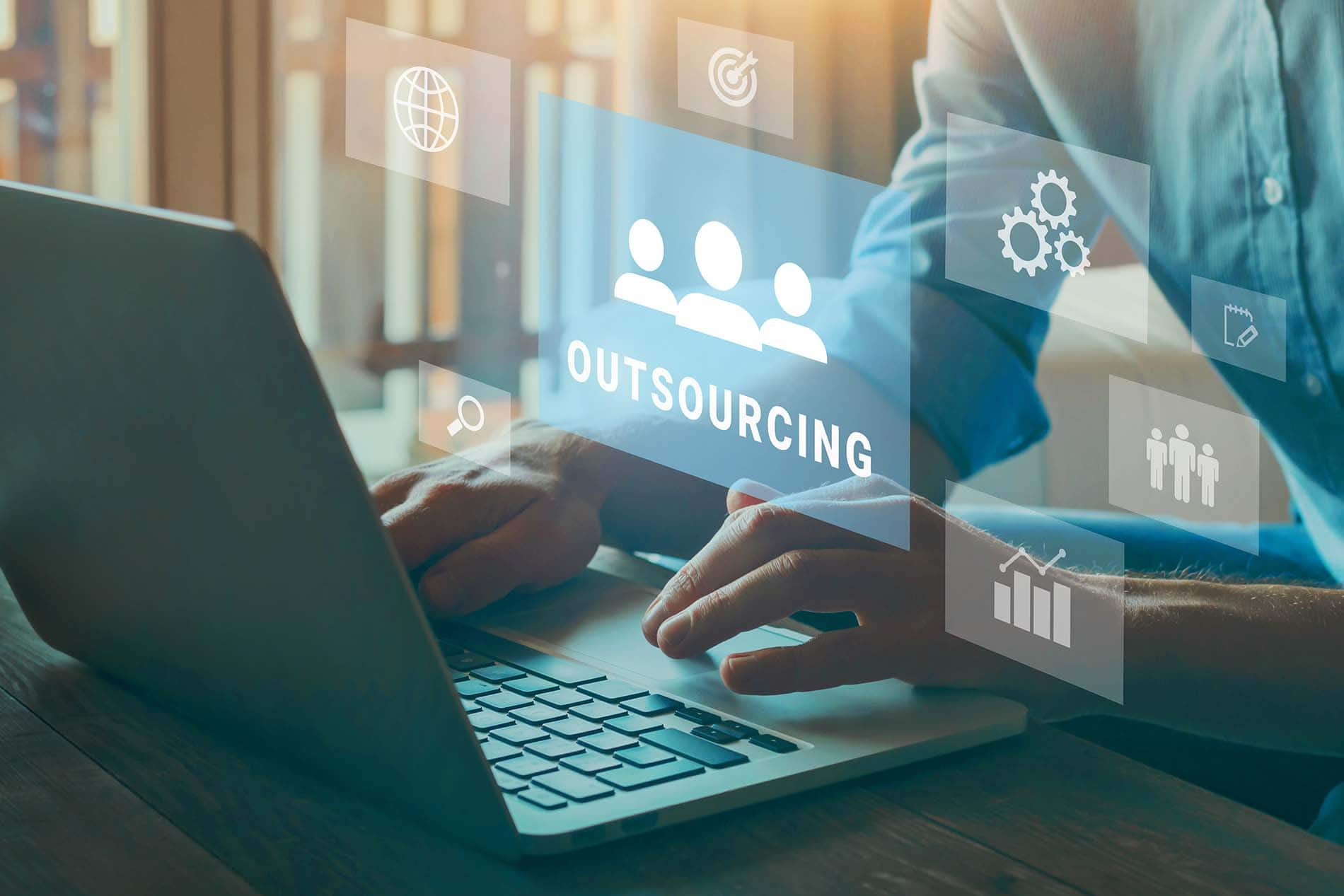 Outsourcing Lead Generation in 2025 Business person using digital tools for outsourcing lead generation strategies.