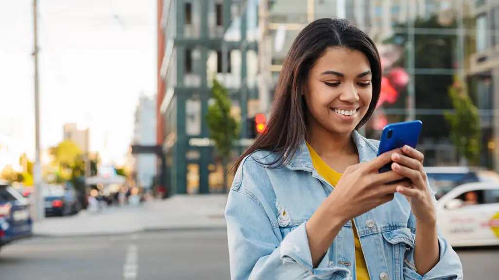 Woman scrolling on phone seeing multiple marketing messages