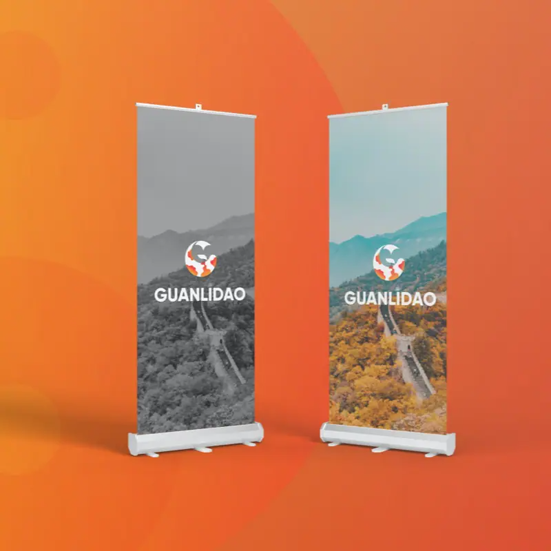 banner-up Two vertical display banners stand side by side. Designed by a skilled graphic designer, each shows a mountain landscape—one in grayscale, the other in color—with a circular logo and GUANLIDAO on an orange gradient background.