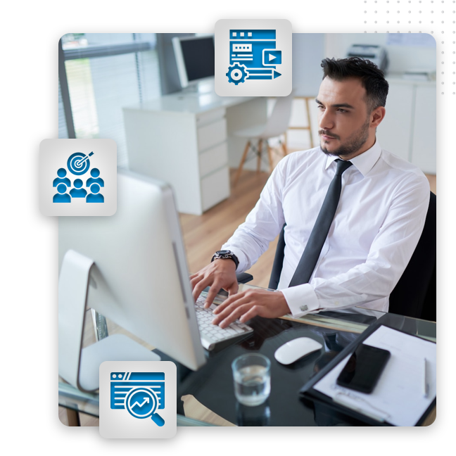 content marketing SEO Content feat img A man in a white shirt and tie works at a computer in a modern office. Around him are three blue business-themed icons representing teamwork, analytics, and web development—ideal for a content marketing agency or SEO content writer.