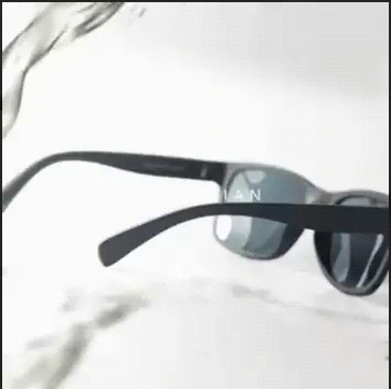 sunglasses A stream of water is poured over black sunglasses from a graphic designer, but the water beads up and rolls off, leaving the lenses dry and clear.
