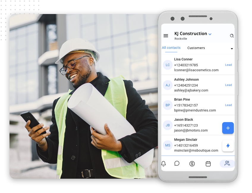 xtreme-leads-app-manage-your-leads-img A smiling construction worker in a hard hat and safety vest holds blueprints and checks his phone; next to him, a phone screen displays a construction contacts app with details about Web Design Packages and Custom Web Design Pricing.