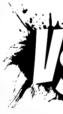 Partial view of bold black and white VS text with jagged black ink splatter background on a light gray surface, perfect for online marketing visuals.