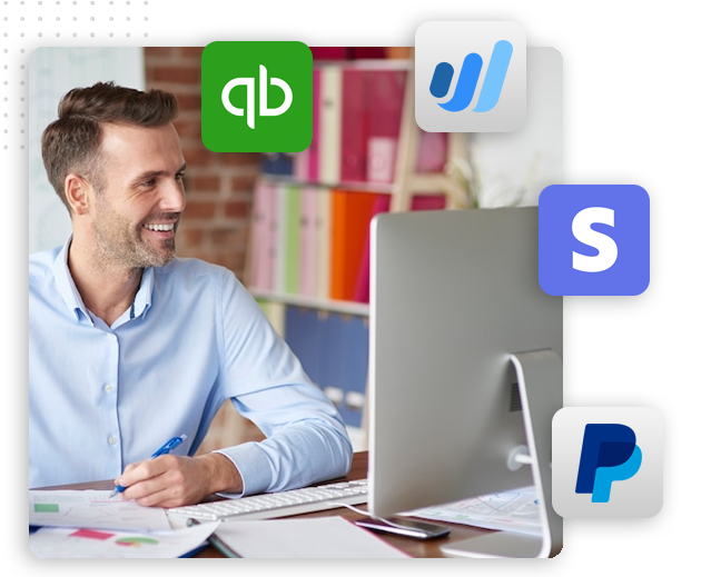 xtreme-automator-gateway-acounting-Collection-img A smiling man sits at a desk working on a computer, surrounded by logos of QuickBooks, Wave, Stripe, and PayPal, suggesting he is managing finances for an automation company or integrating a CRM platform with these payment solutions.